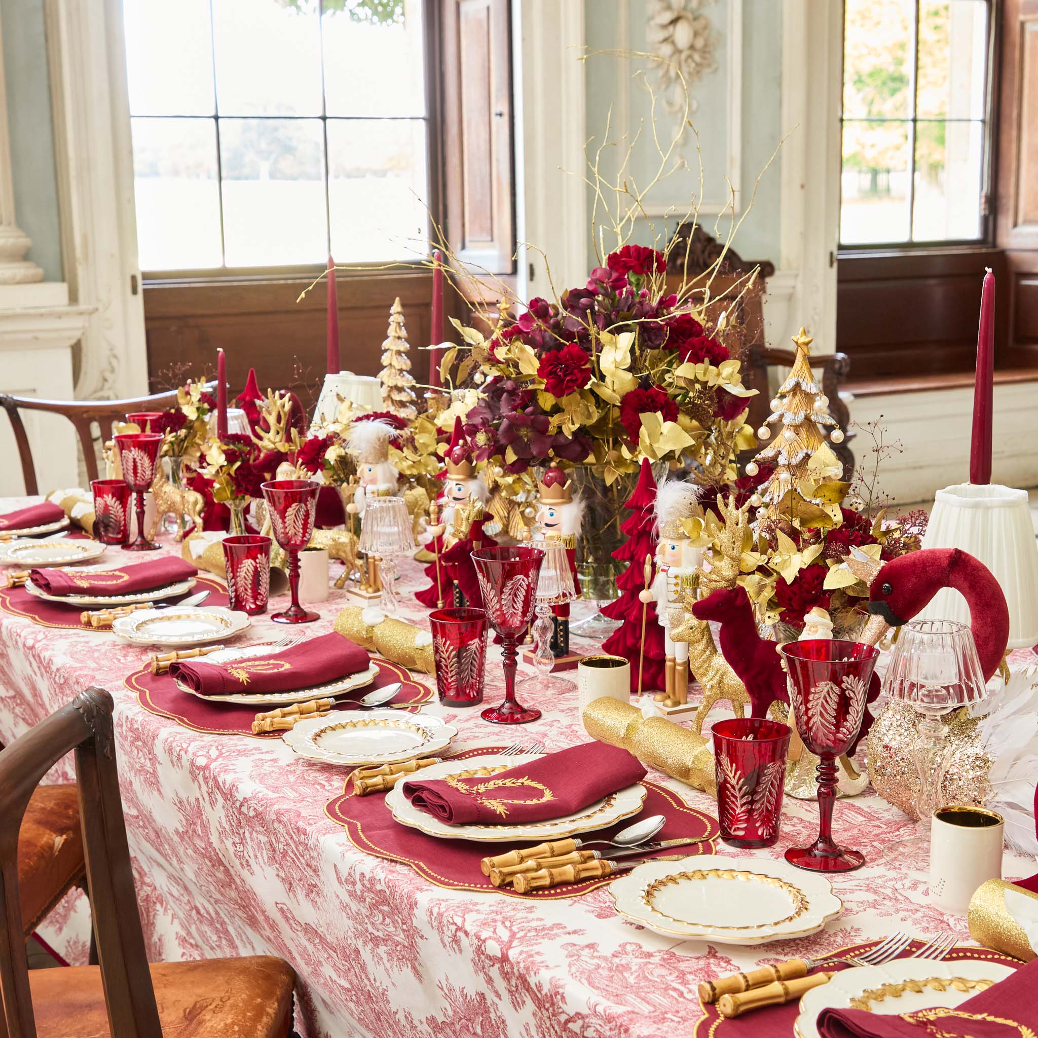 Decorative Christmas table setting with red and gold theme