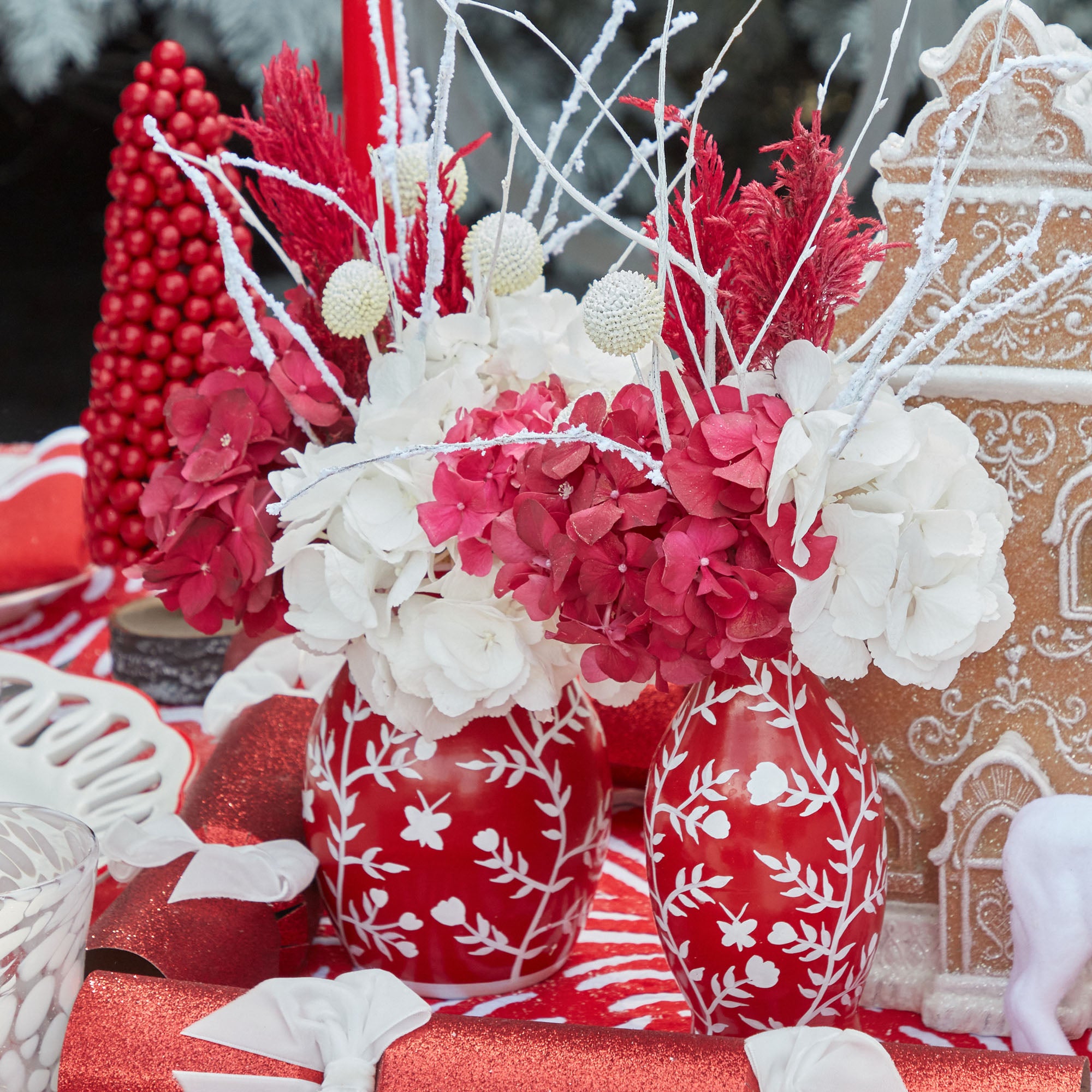 Create a stunning centerpiece with the Set of 3 Red Hand Painted Tole Bud Vases.