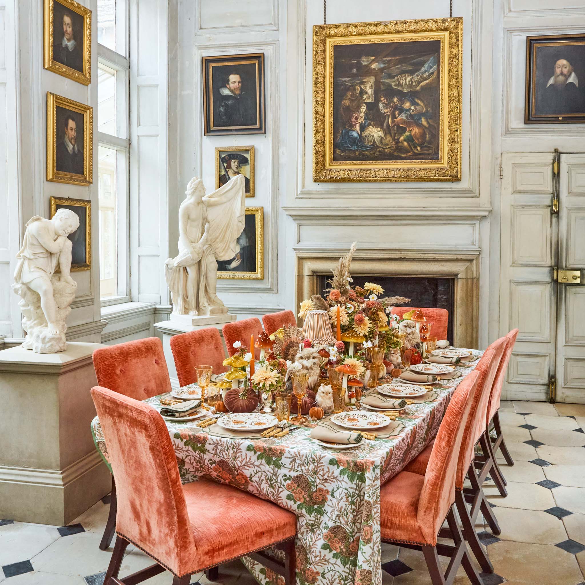 Elegant dining room with floral tablecloth, orange chairs, and classical sculptures. Bamboo Cutlery Set