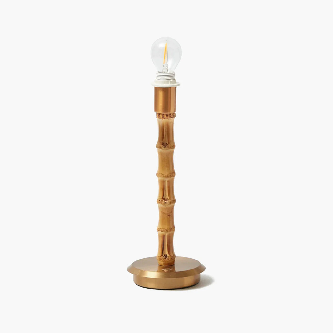 A rechargeable lamp with a golden base and bamboo-like structure, topped with a light bulb.