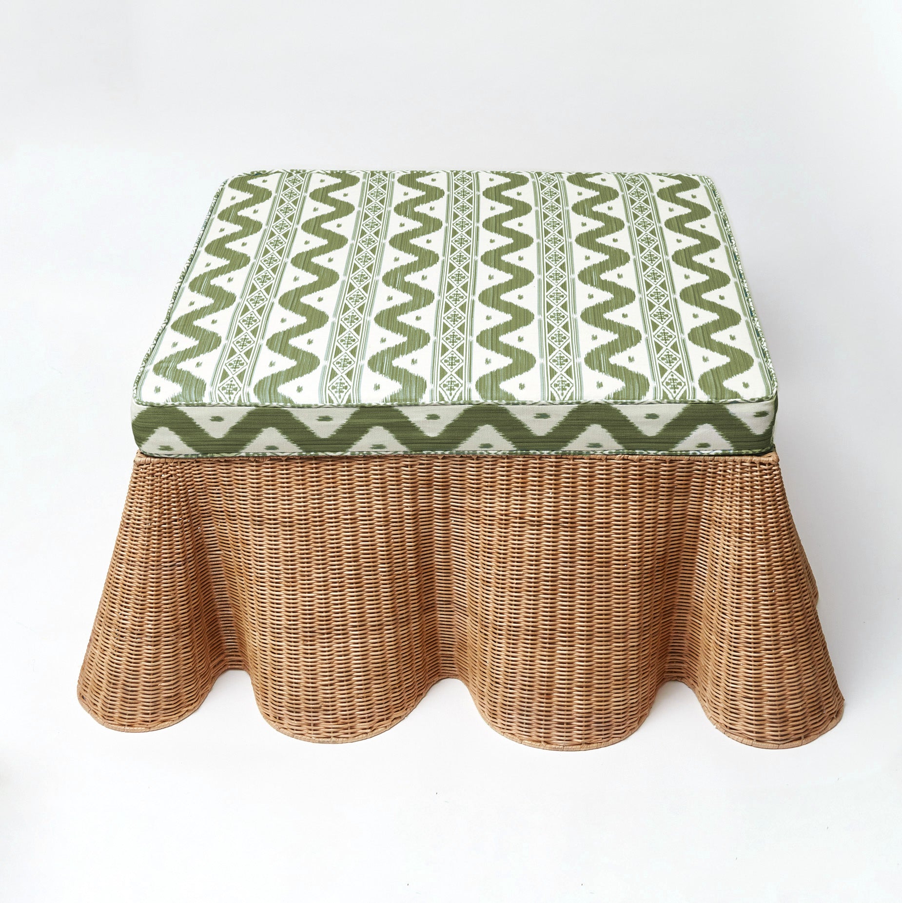 Enhance your interior with the warmth, inviting presence, and multifunctionality of the Vivienne Rattan Scalloped Ottoman, designed to bring a touch of coastal beauty, style, and comfort to your decor.