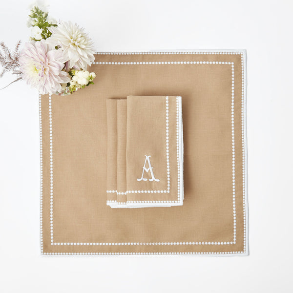 Set of 4 napkins in the elegant Mariana Sand design.