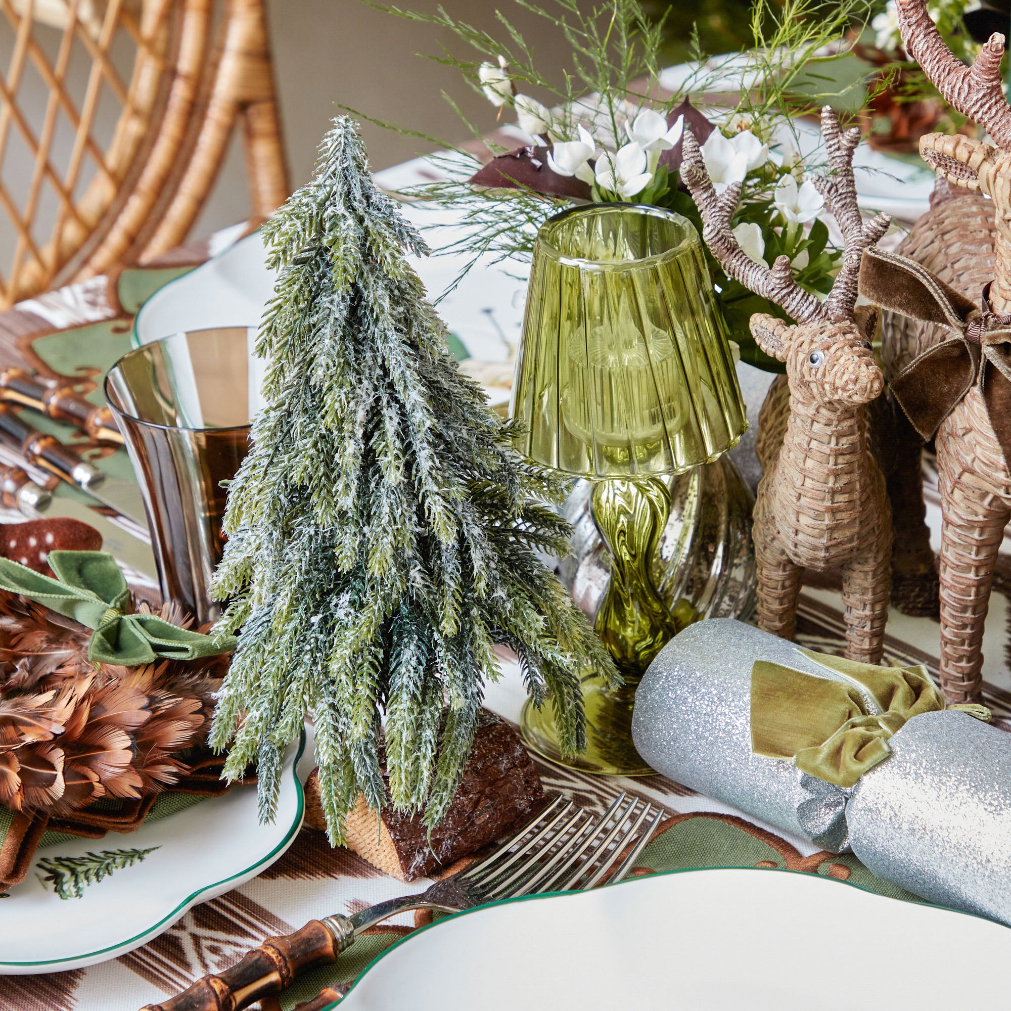 Elevate your Christmas decor with the whimsical and enchanting beauty of our Pair of Frosted Fir Trees - a simple yet stylish statement of seasonal sophistication.