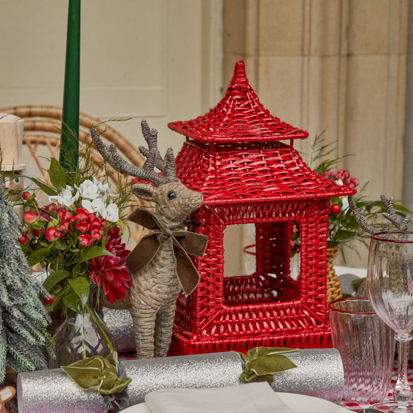 Elevate your festive ambiance with the Berry Red Rattan Pagoda Lantern, a delightful lantern that radiates sophistication and captures the spirit of the season.