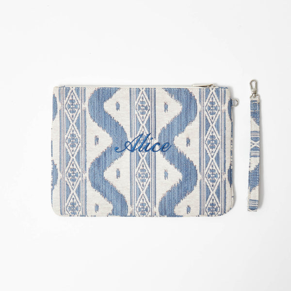 Impress your friends with the delightful charm of the Blue Ikat Pochette, an accessory that adds a touch of sophistication and a dose of vibrant blue hues to any look.
