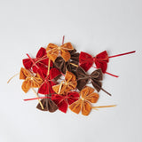 Infuse warmth into your meal presentation with Burnt Orange Napkin Bows, a charming set of 4.