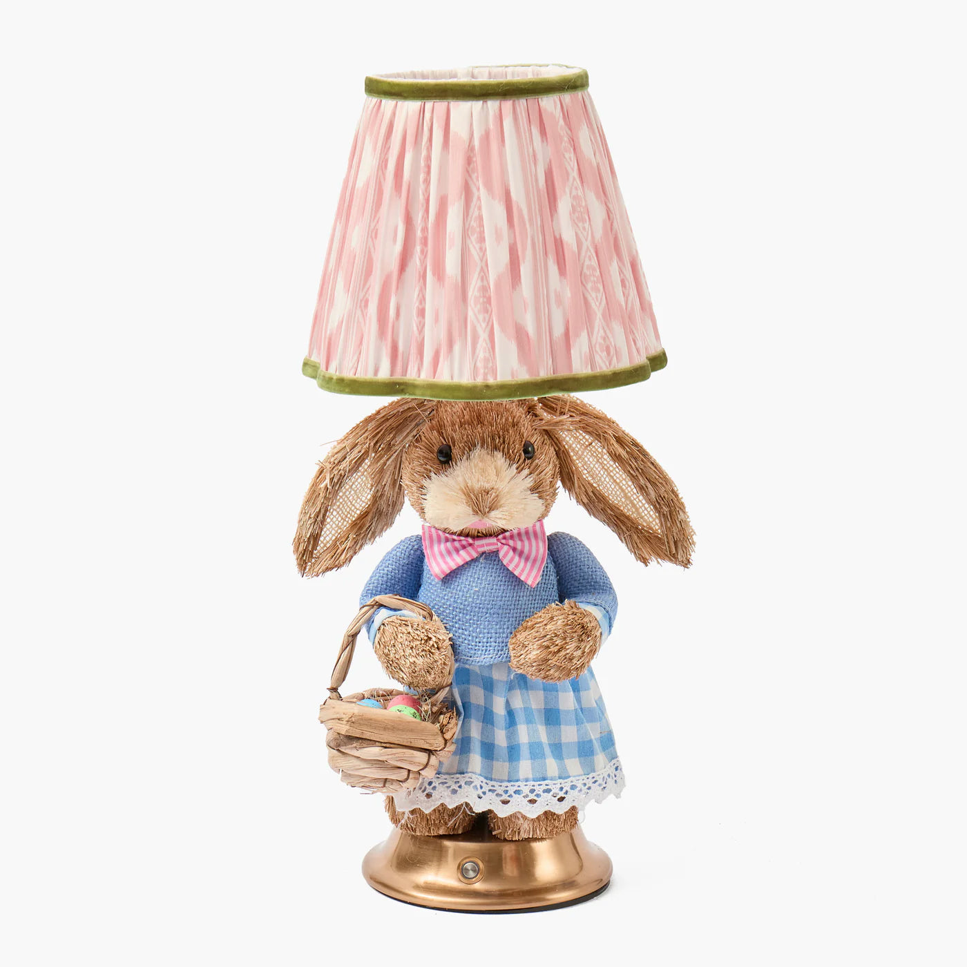 Decorative lamp with a rabbit figure holding a basket on a white background