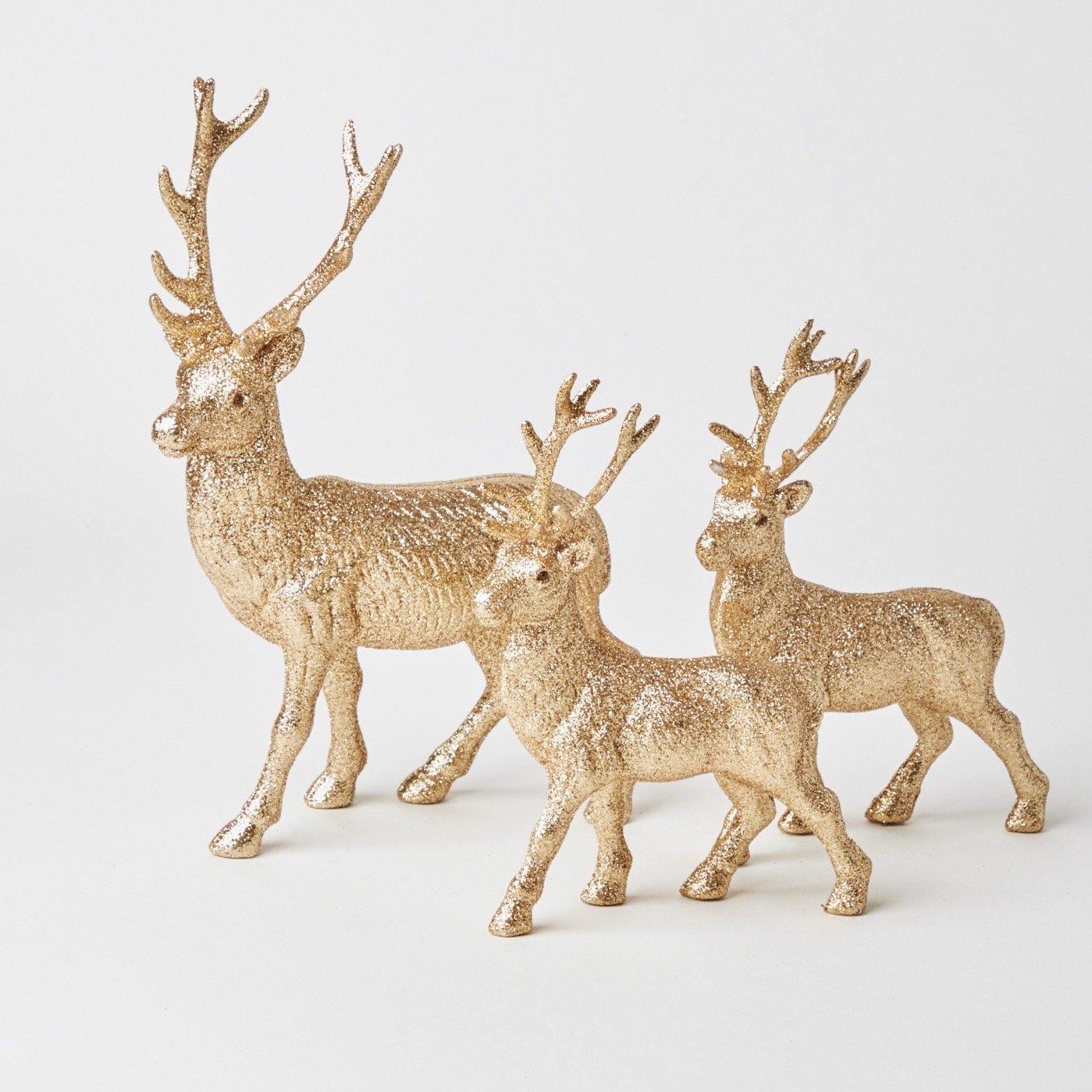 Elevate your holiday decor with our gold glitter reindeer family - a sparkling addition to your Christmas festivities.