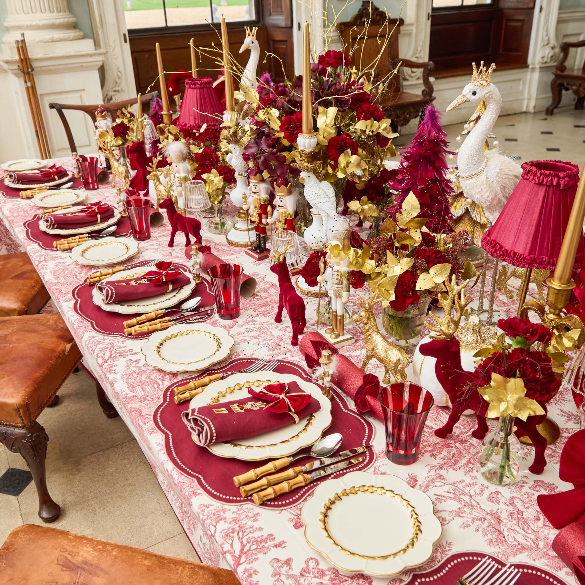 Decorative Christmas table setting with red and gold theme