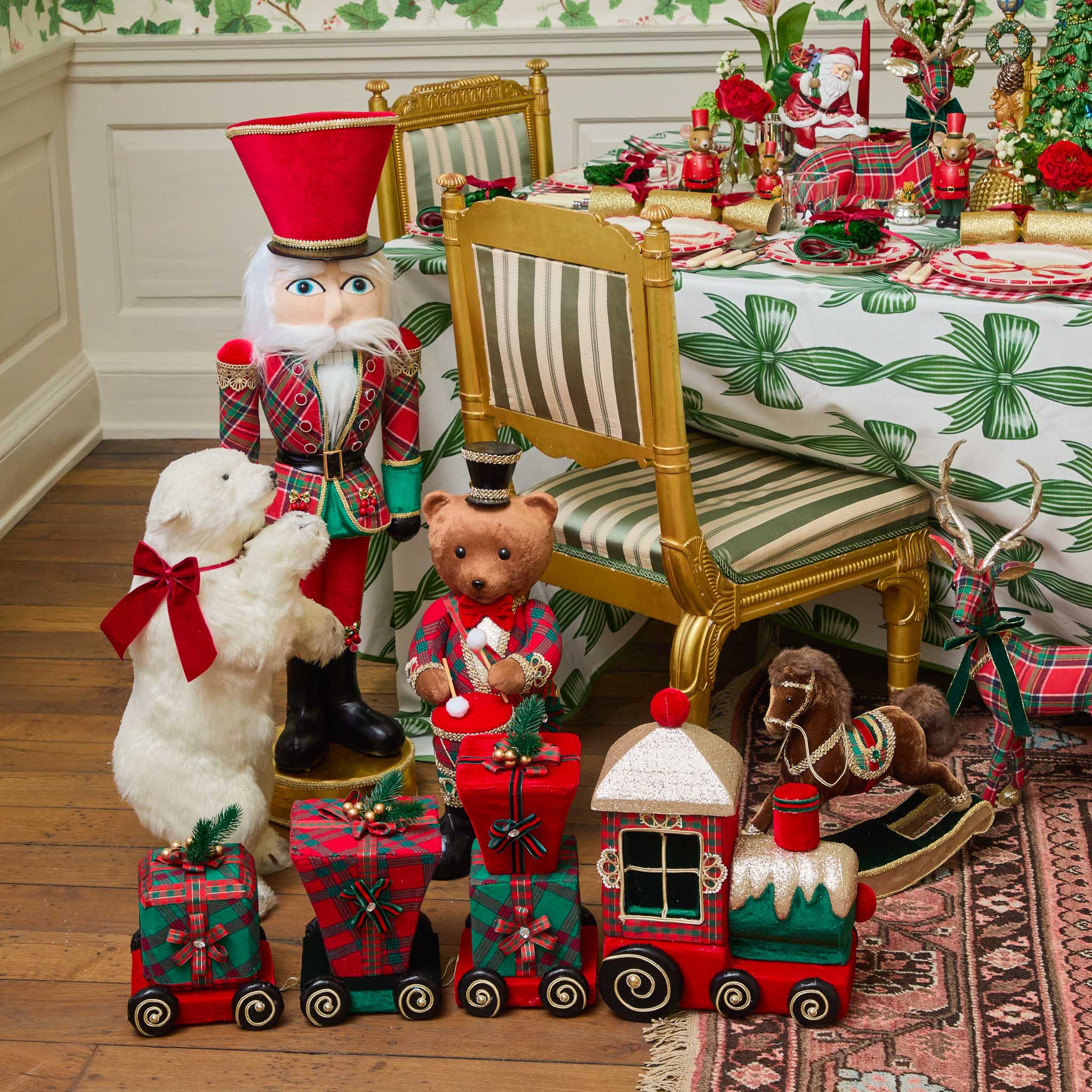 Decorative Christmas scene with toys and a table set for a festive meal.