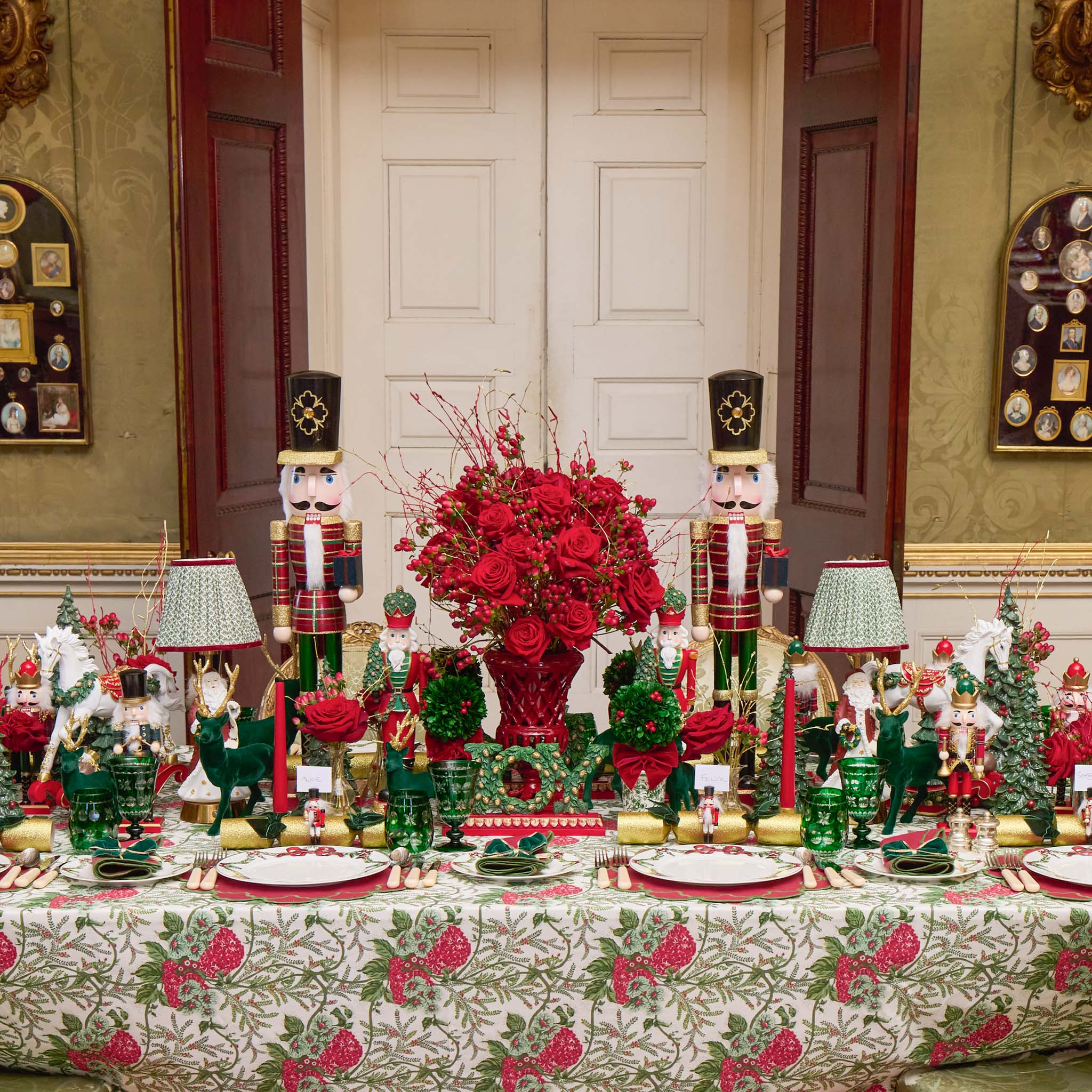 Mrs Alice's Decorative Christmas table setting with nutcrackers, red flowers, and festive tableware.