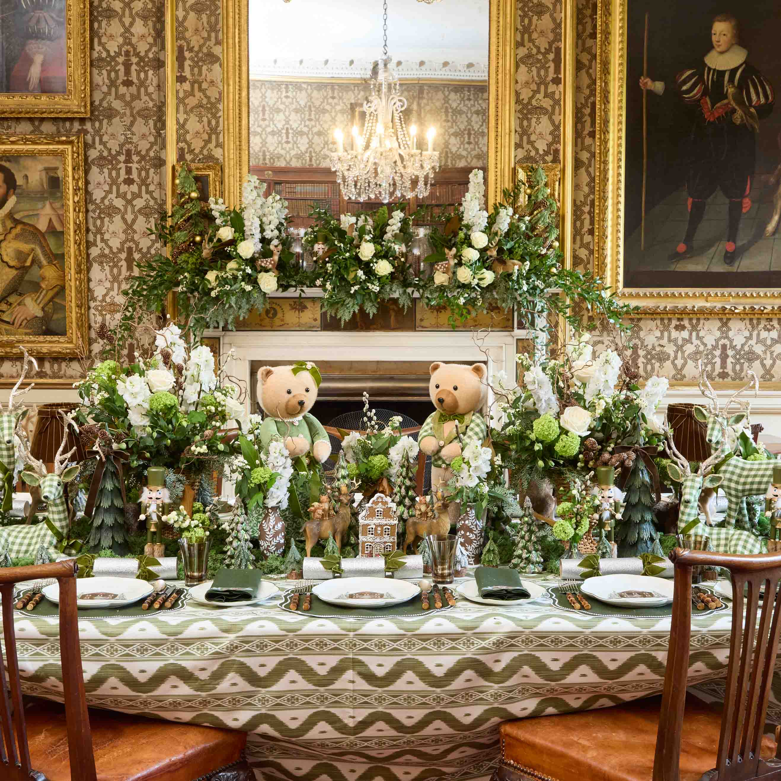 Decorative table setting with teddy bears and floral arrangements in an elegant room.