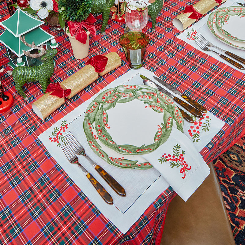 Delight in the enduring charm of the Bonnie Tartan Tablecloth, a classic piece that adds a touch of holiday tradition to your dining occasions.