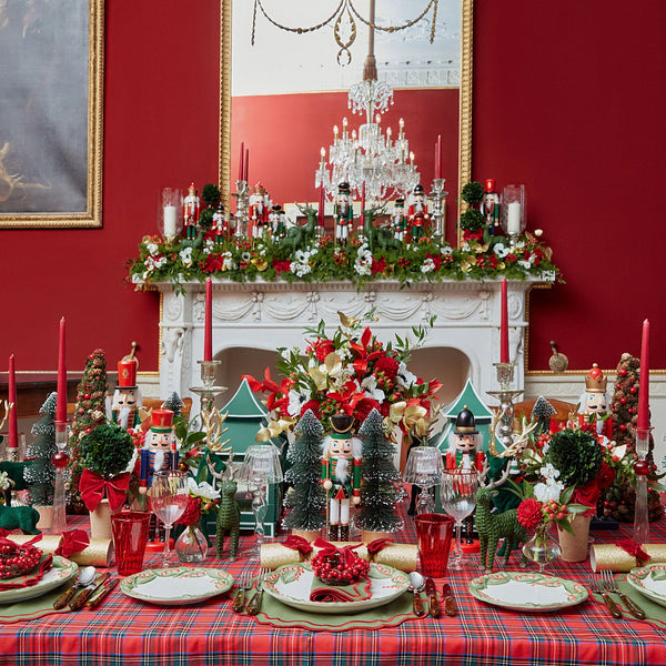 Create a warm and inviting holiday table with the Bonnie Tartan Tablecloth, adorned with a traditional tartan pattern that embodies the spirit of Christmas.