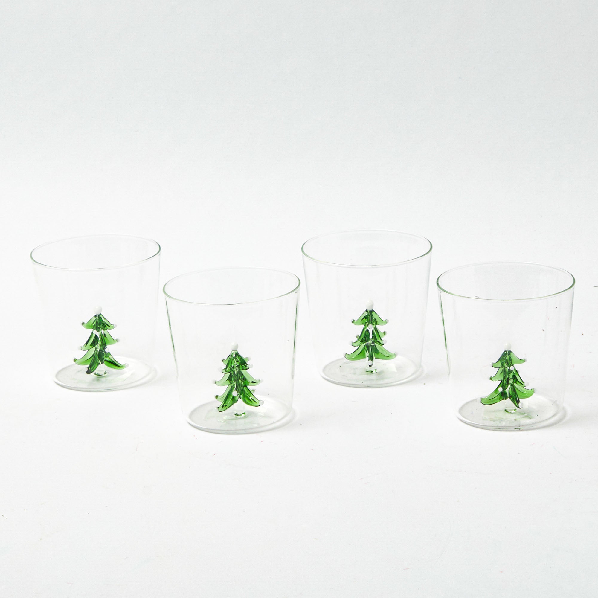 Add a touch of yuletide joy to your table settings with these Christmas Tree Glasses.