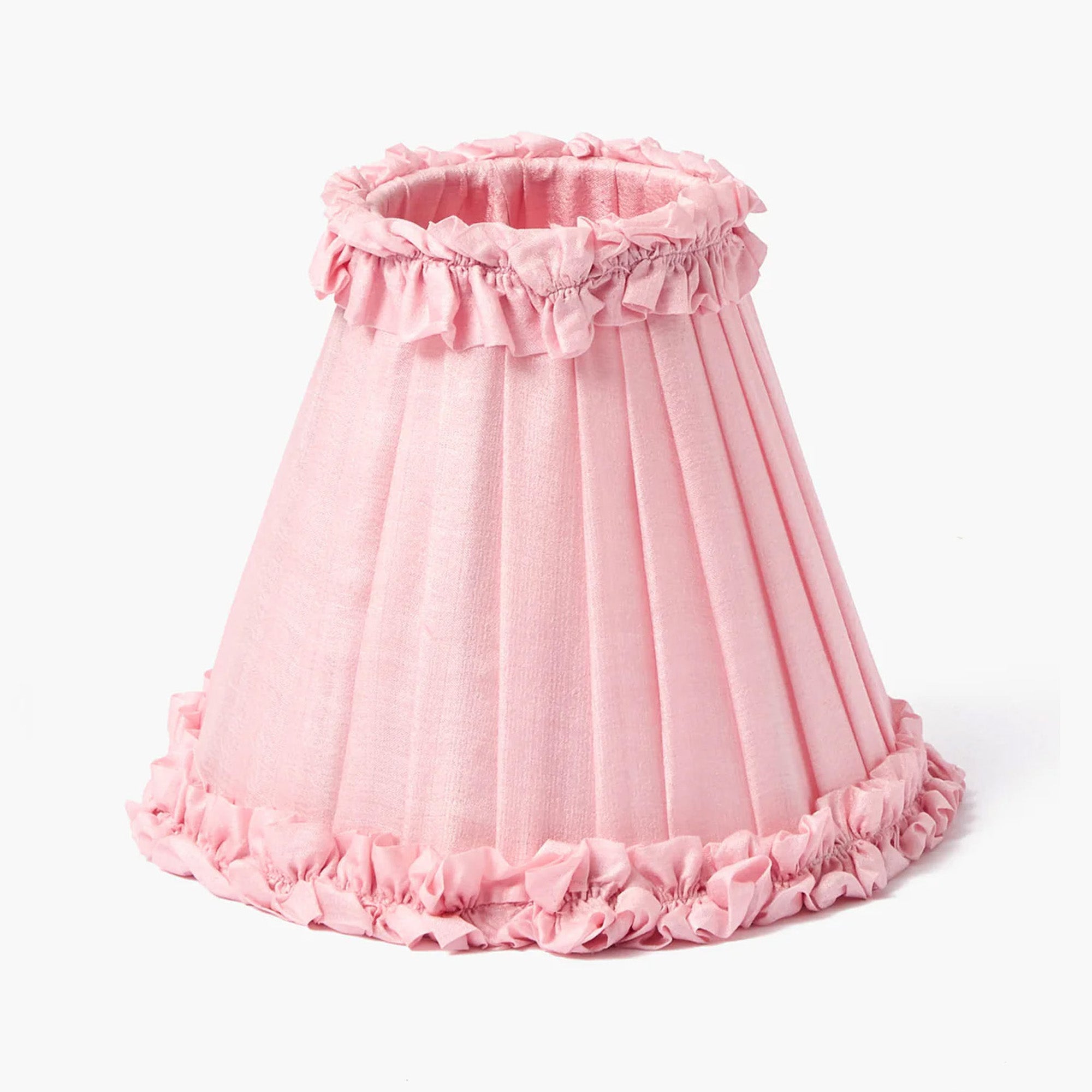 Pink lampshade with ruffled edges on a white background