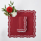 Elevate your Christmas table with the whimsical and enchanting Katherine Berry Red Placemats & Napkins Set - a simple yet stylish statement of holiday sophistication.