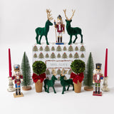 Illuminate your Christmas decor with the whimsical and enchanting Large Forest Green Flocked Reindeer Pair, designed to bring the magic of the holiday season to your festive home in the heart of the forest.