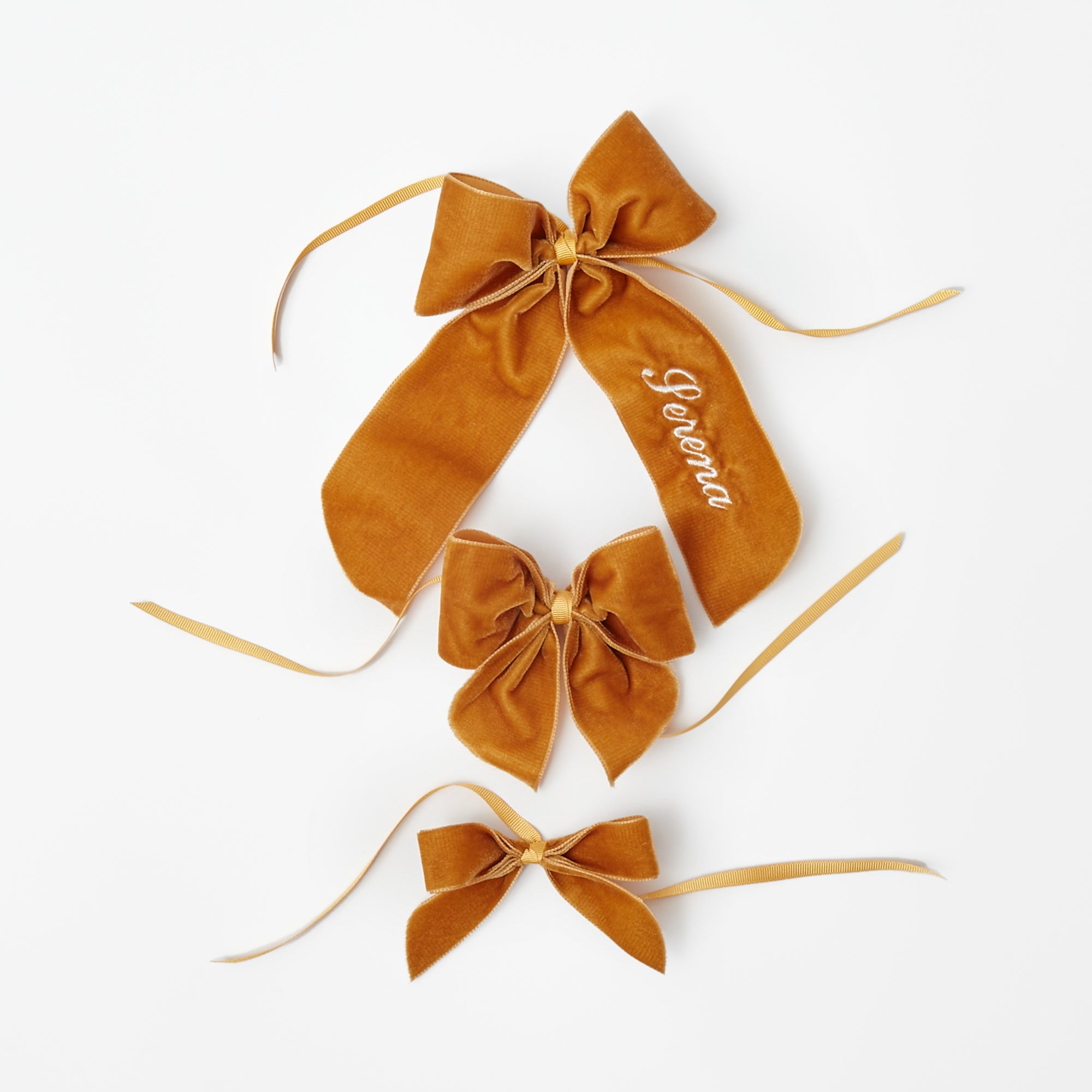 Personalizable bow in a vibrant mustard shade for customization.