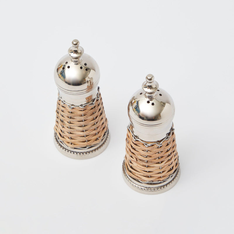 Duo of salt and pepper shakers in a sleek rattan design.
