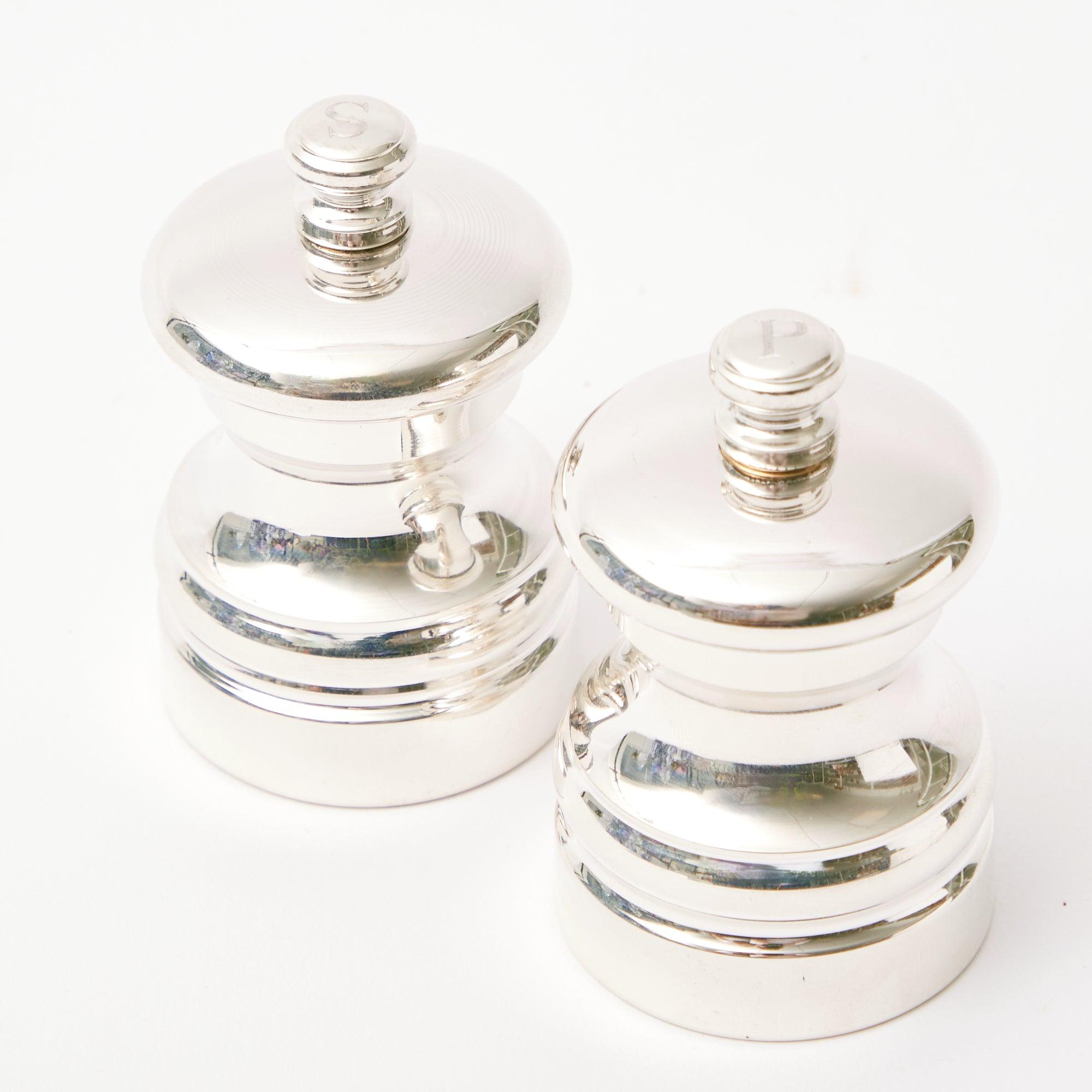 Pair of Sterling Silver Salt & Pepper Shakers: Timeless elegance.