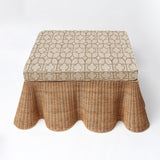 Enhance your interior with the captivating and inviting presence of the Vivienne Rattan Scalloped Ottoman, designed to bring a touch of coastal beauty, style, comfort, and multifunctionality to your decor.