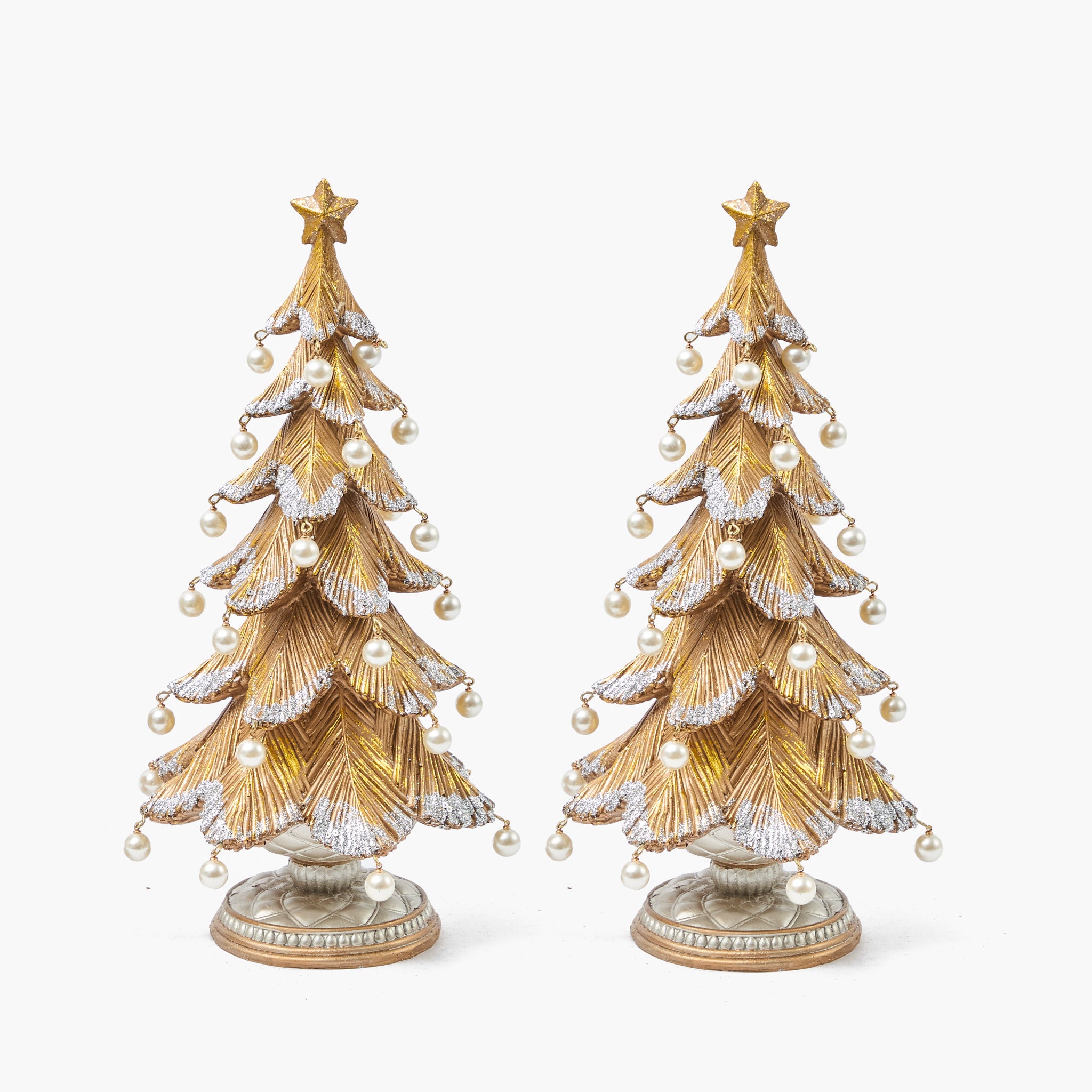 Two decorative Christmas trees with gold and white ornaments on a white background
