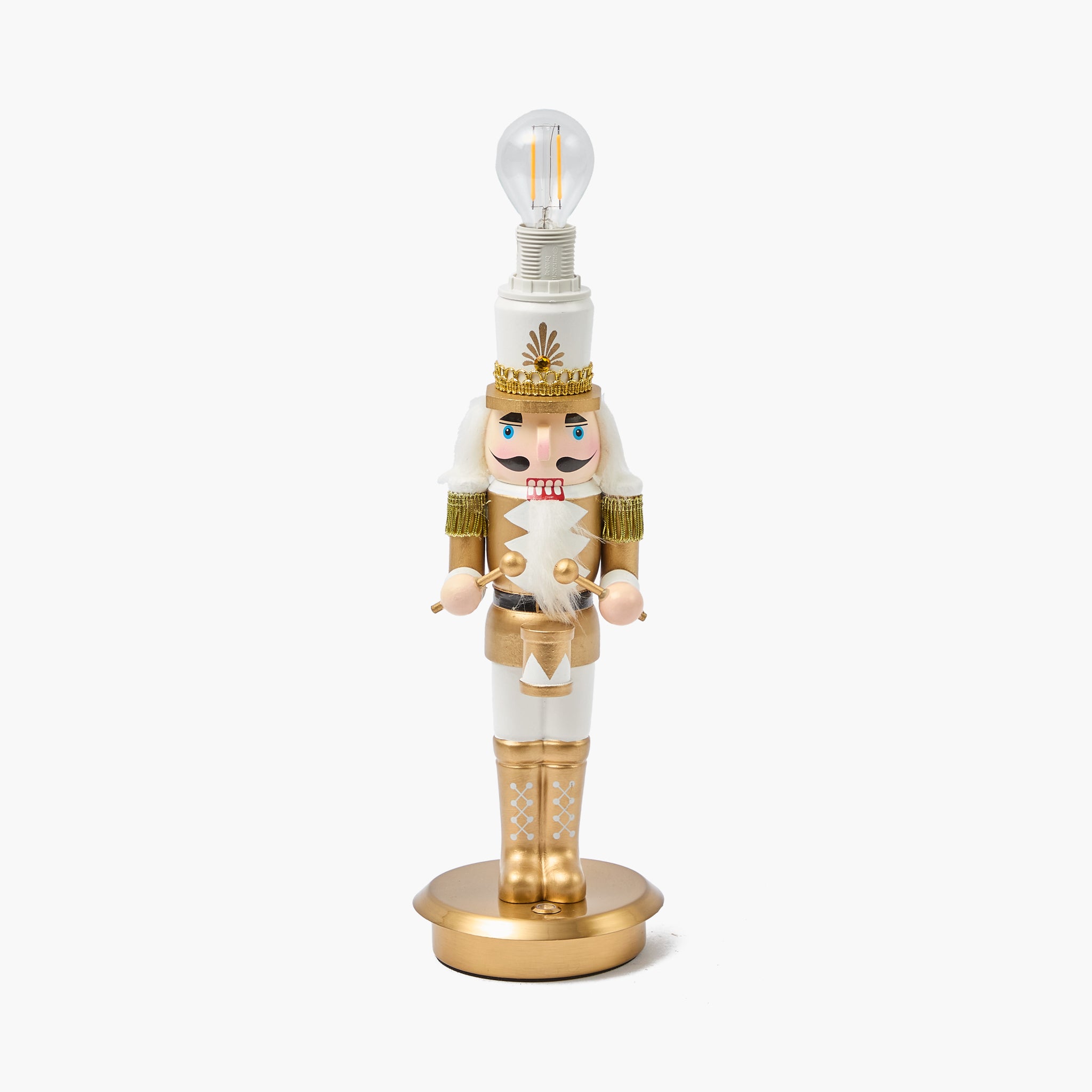 Nutcracker-shaped lamp with a light bulb on a white background