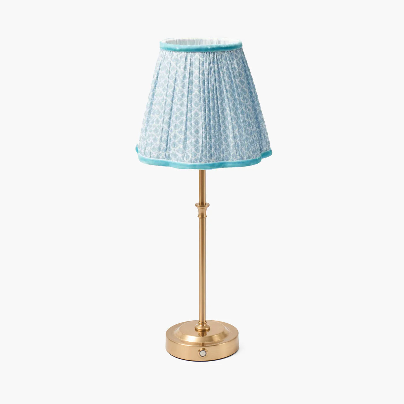 Small lamp with a blue patterned shade on a white background