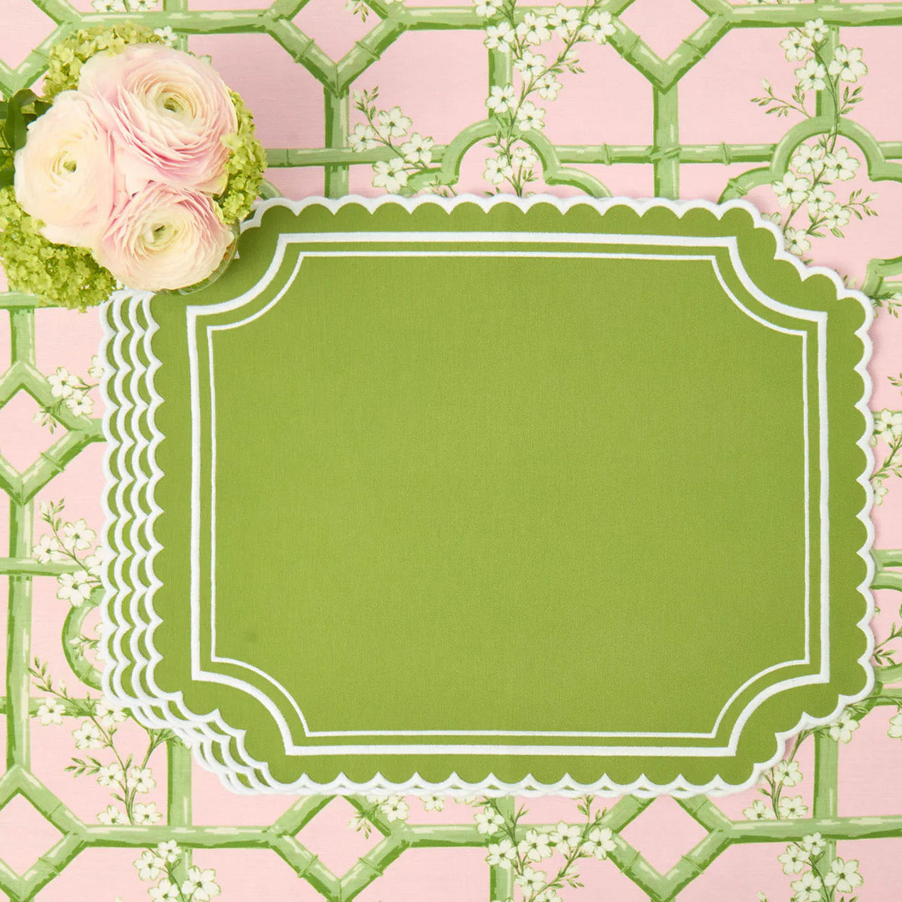 Decorative green label on a pink and green lattice background with flowers.