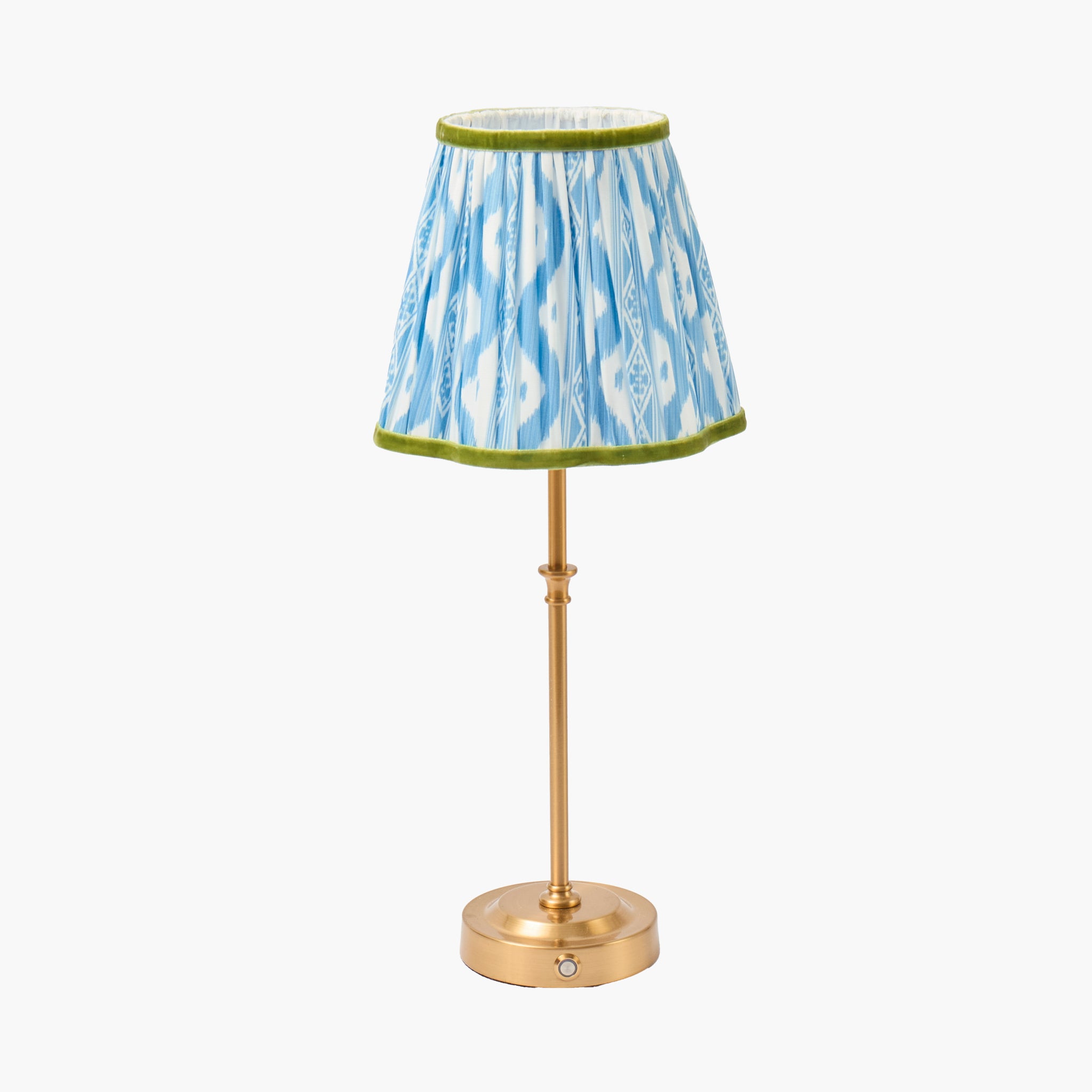 Small lamp with a blue and white patterned shade on a white background
