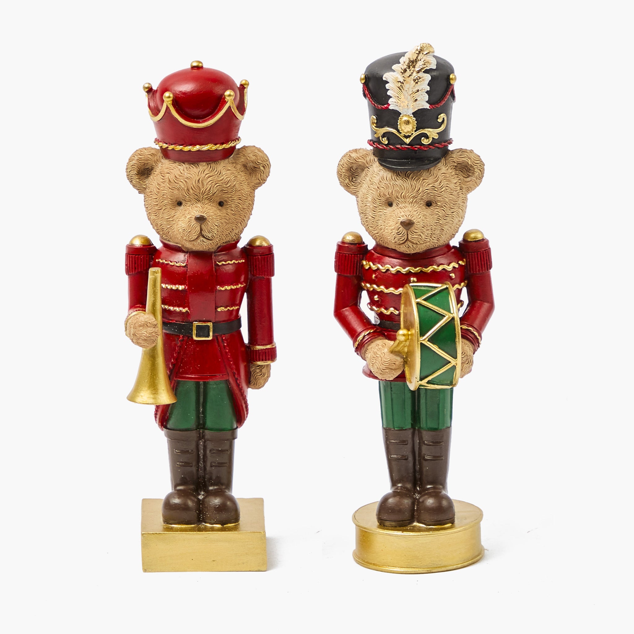 Two teddy bear figurines dressed as toy soldiers on a white background