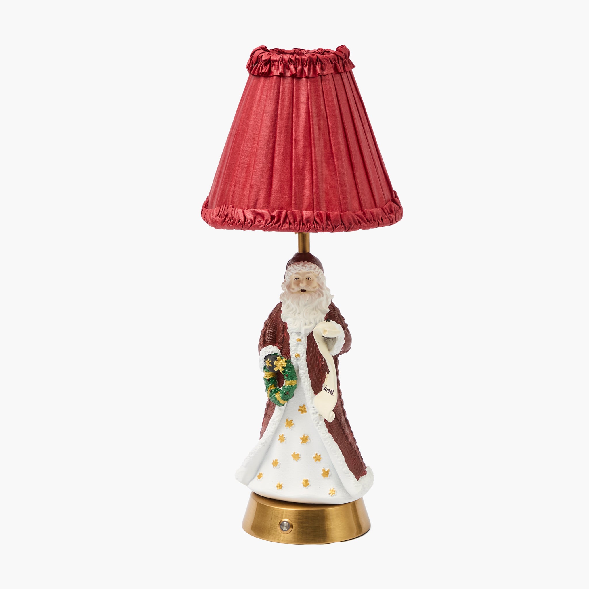 Decorative lamp with a red shade featuring a Santa Claus figure on a white background