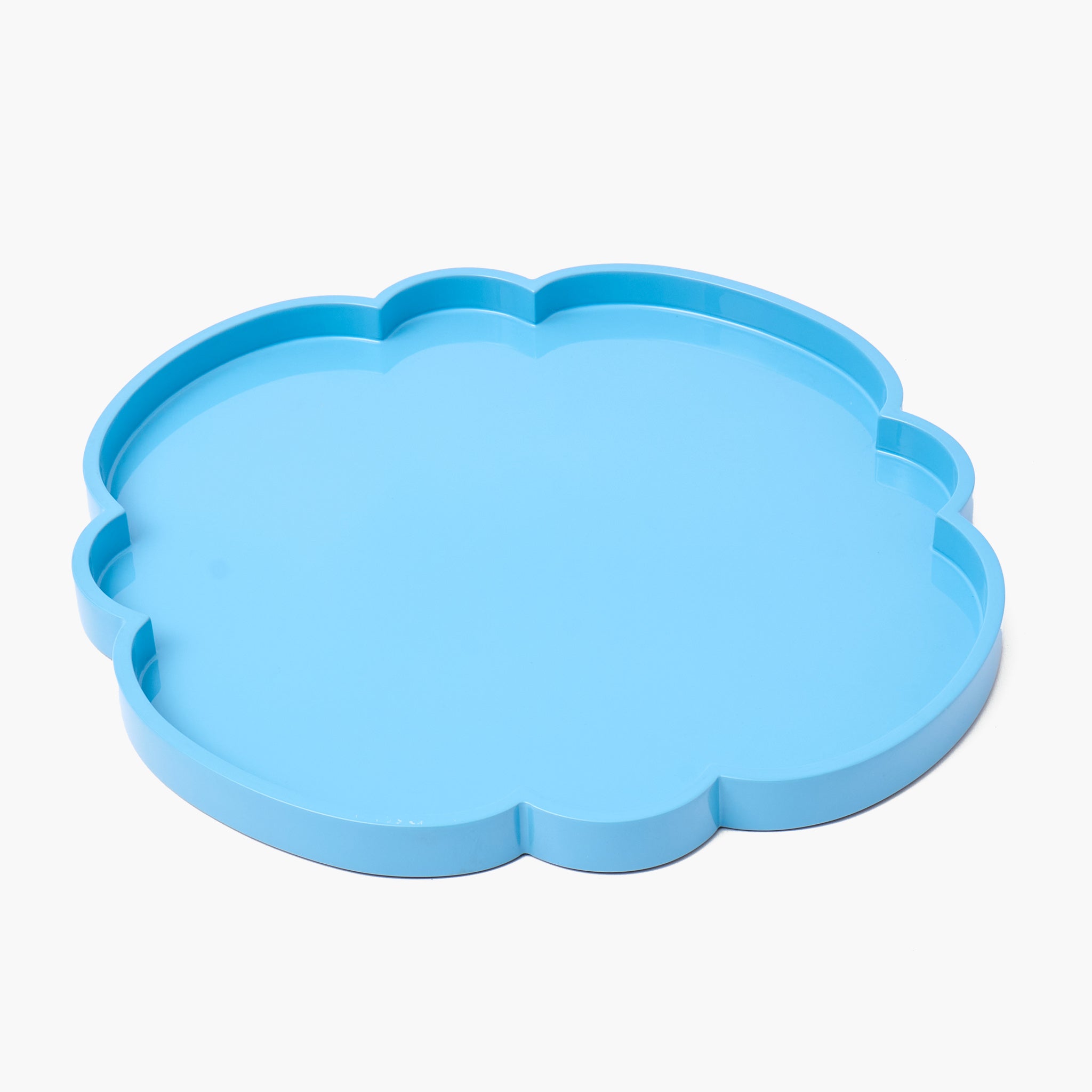 Blue cloud-shaped tray on a white background