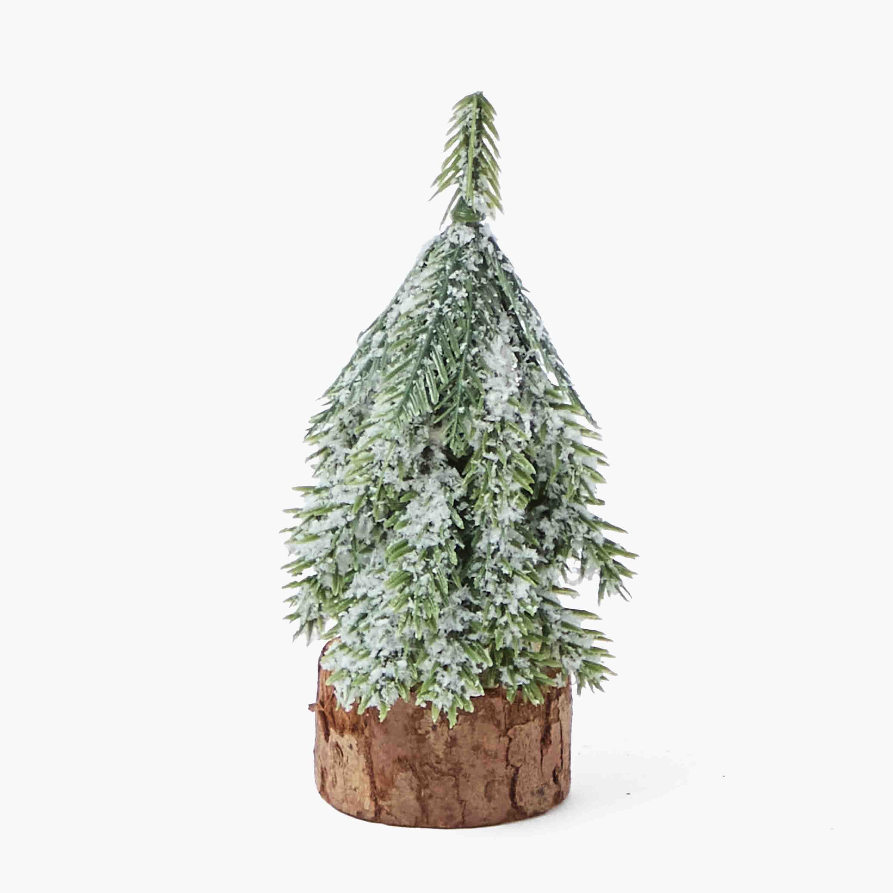 Artificial Christmas tree with snow effect on a white background