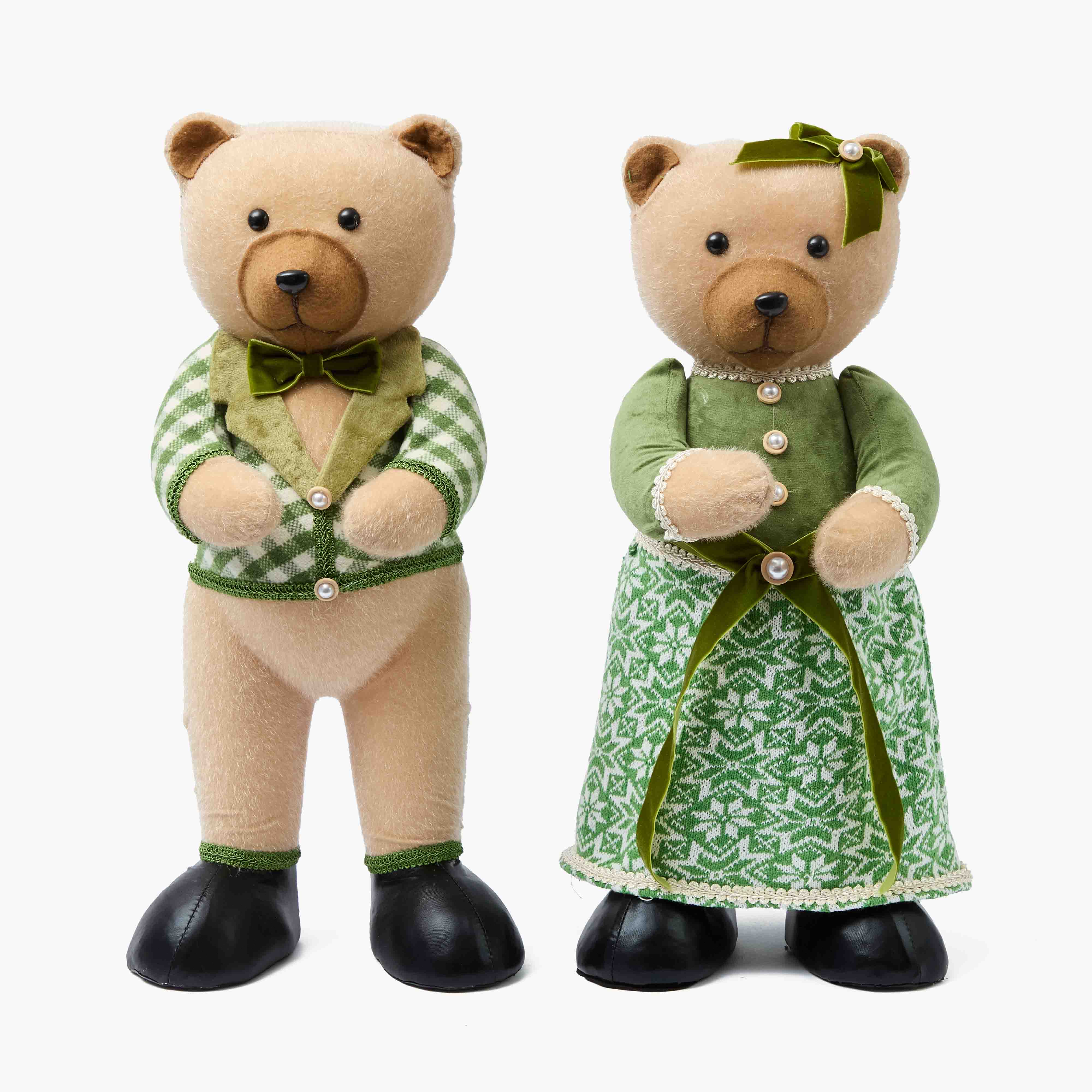 Two teddy bears, one male and one female, dressed in green outfits on a white background.