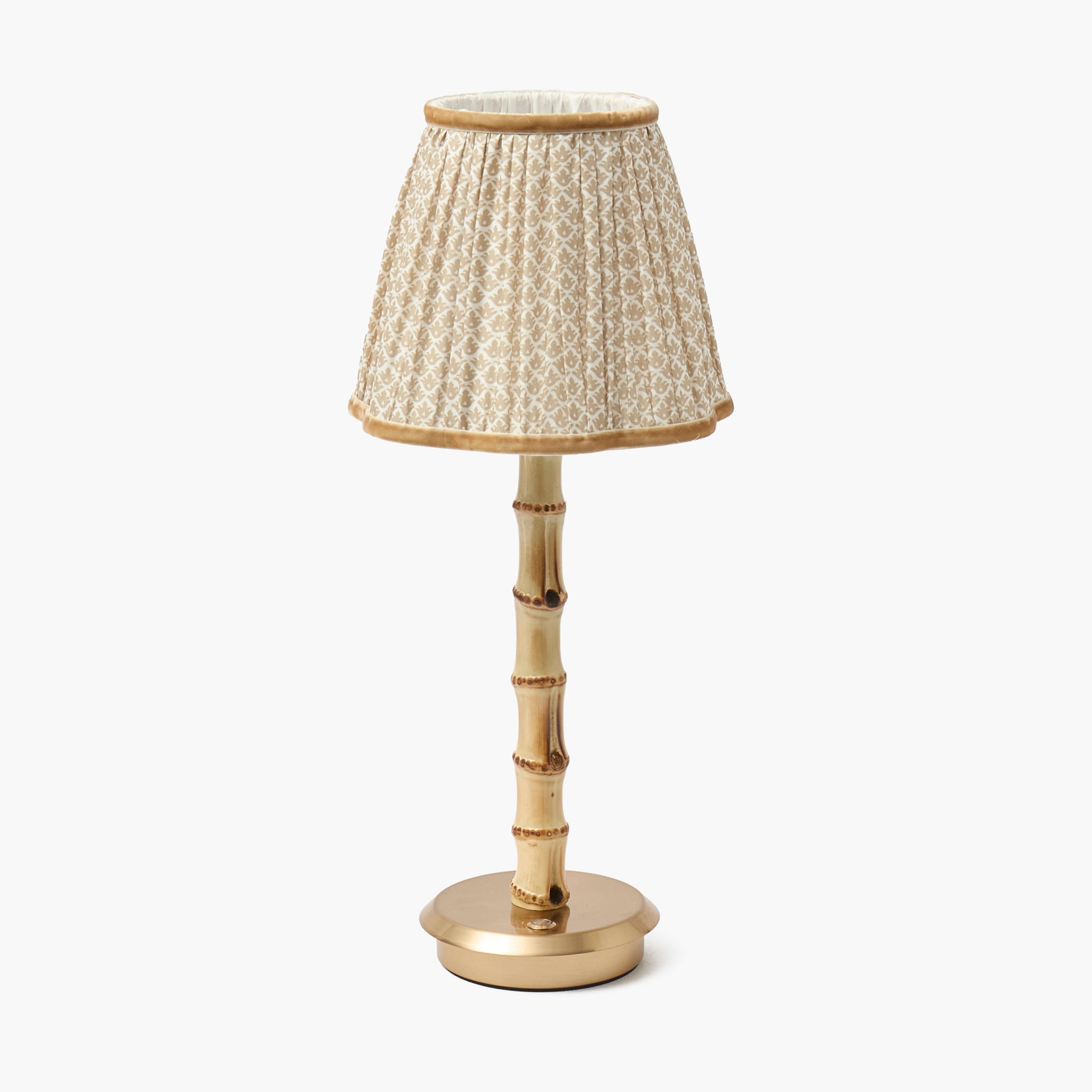 Table lamp with bamboo design and patterned shade on a white background