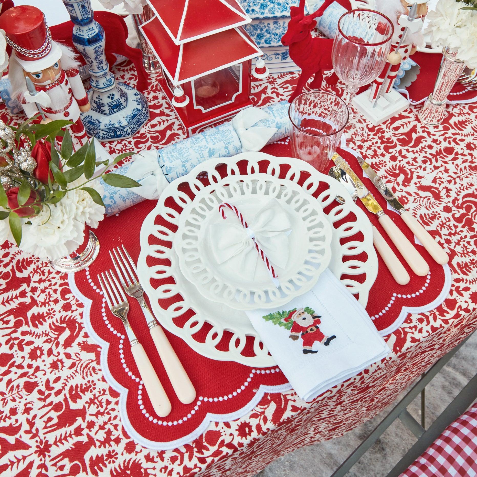 Elevate your Christmas decor with the intricate and enchanting beauty of the White Hand Embroidered Father Christmas Napkins - a simple yet stylish statement of holiday sophistication.