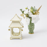 Elevate your Christmas decor with the whimsical and enchanting White With Gold Mini Pagoda Lanterns - a simple yet stylish statement of holiday delight with a touch of elegance.