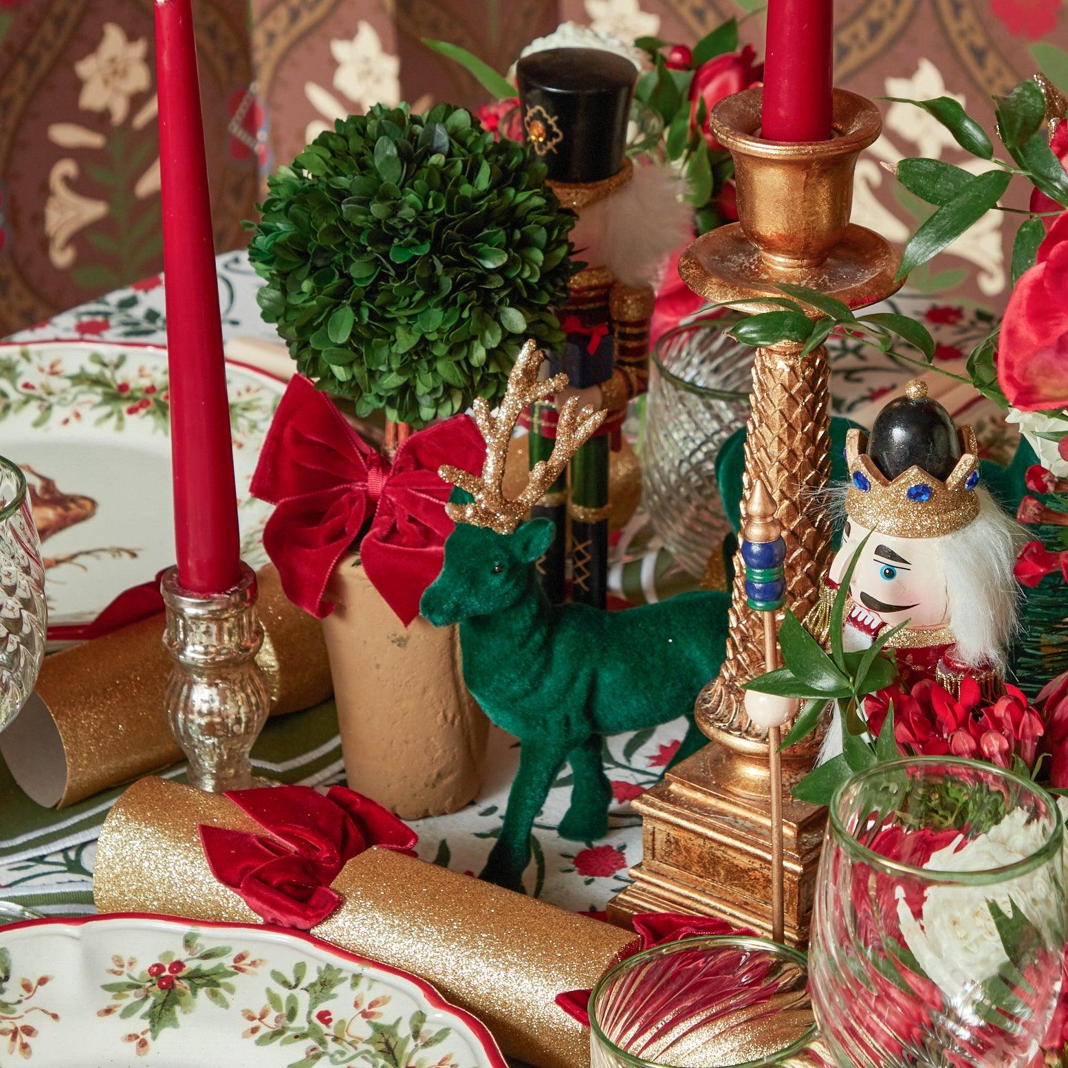 Illuminate your Christmas decor with the whimsical and enchanting Red Ribboned Potted Boxwood Balls, designed to bring the magic of the holiday season to your festive home.