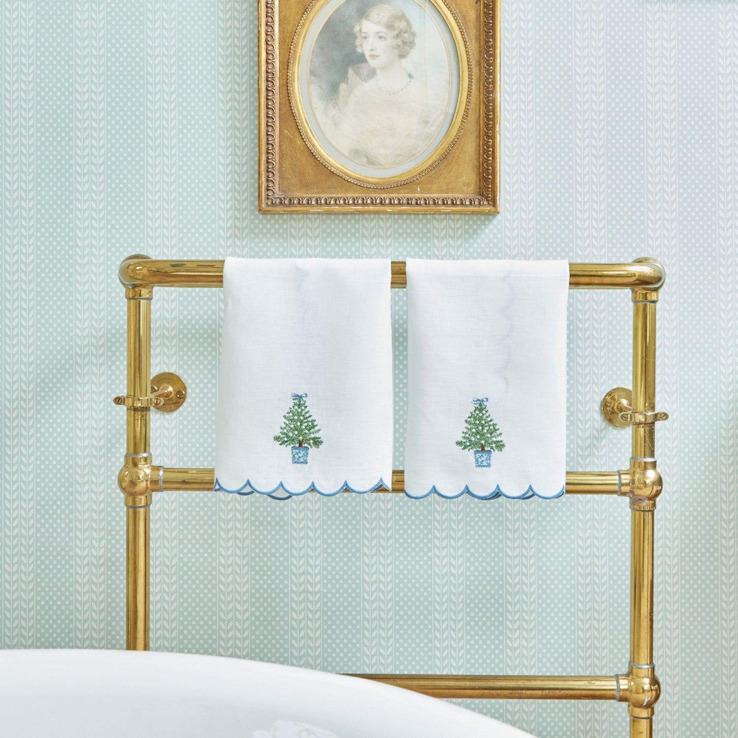 Create a festive and enchanting Christmas atmosphere with the Embroidered Christmas Tree Linen Hand Towel, perfect for infusing your home with holiday charm.