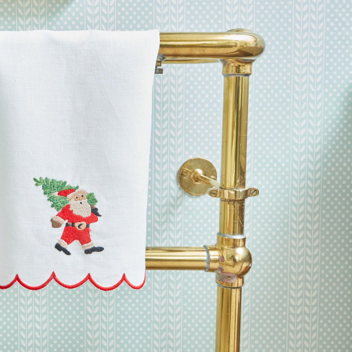 Make each holiday party a celebration of festive charm with the Embroidered Father Christmas Linen Hand Towel, a perfect choice to create a cozy and inviting Christmas atmosphere.