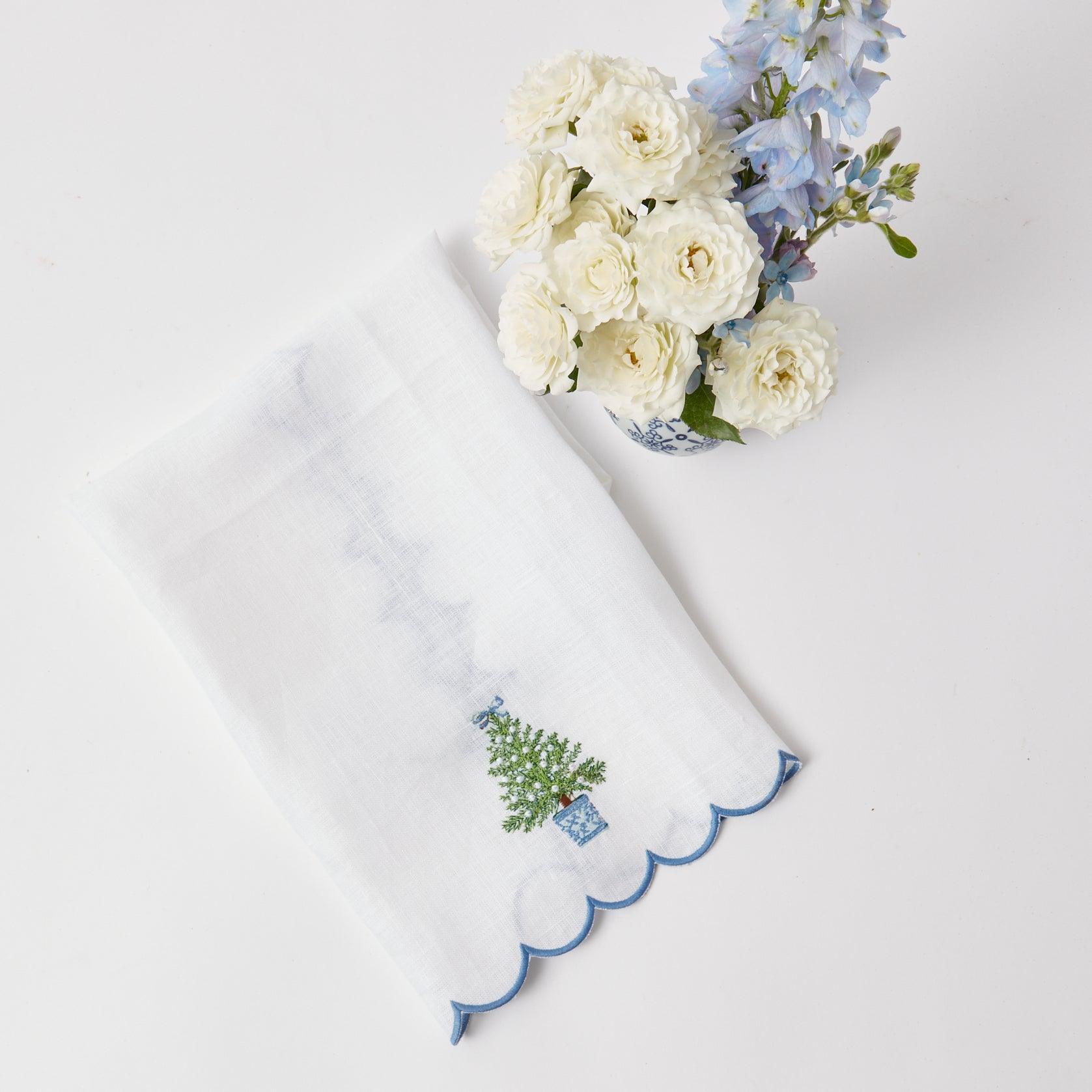 Elevate your holiday decor with the Embroidered Christmas Tree Linen Hand Towel - a charming addition to your bathroom or kitchen that adds a touch of Christmas magic.