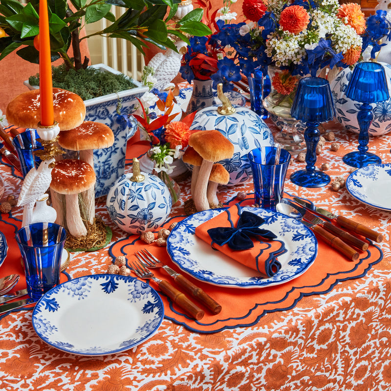 Elegant tablecloth adorned with striking burnt orange pheasant patterns.