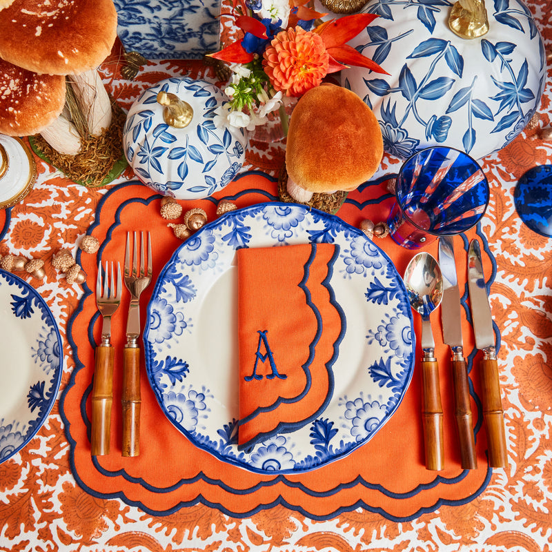 Cloth for the table displaying beautiful burnt orange pheasant designs.