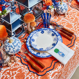 Tablecloth in a burnt orange shade featuring detailed pheasant designs.