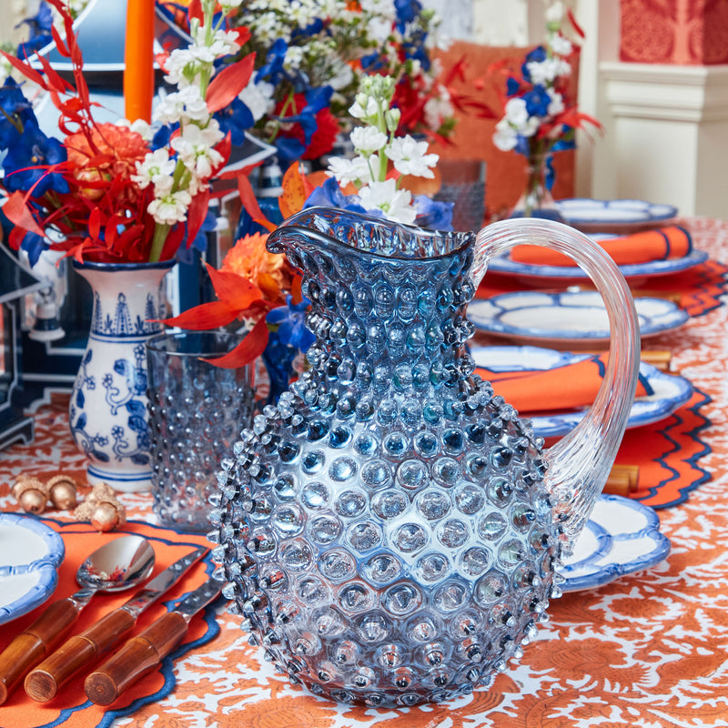 Enhance your dinner parties with the classic charm of our Hobnail Navy Glasses & Jug Set, designed to bring a touch of elegance to your drinking experience.