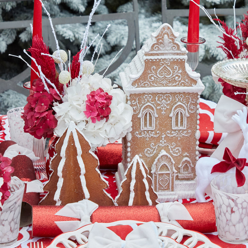 Create lasting memories with the Gingerbread Townhouse (Large), a festive addition to your holiday decorations that radiates the magic and delight of a gingerbread wonderland.