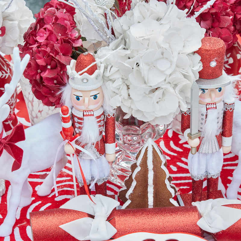 Add a touch of Christmas magic to your space with our Red Glitter Nutcracker Trio, perfect for a joyful atmosphere.