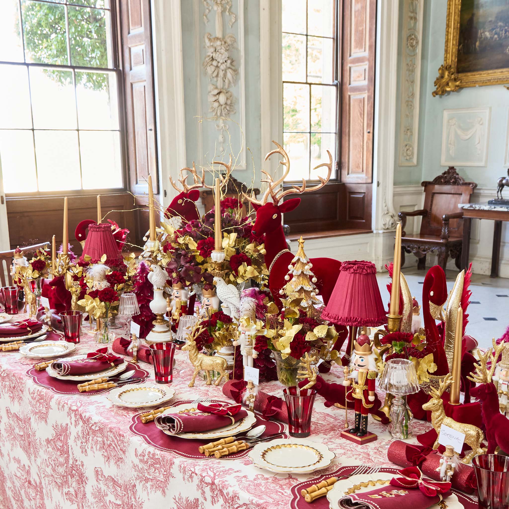 Decorative Christmas table setting with red and gold theme